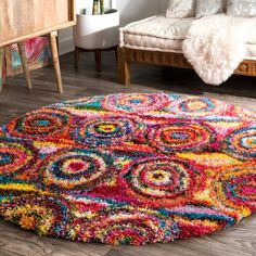 a colorful area rug in a living room