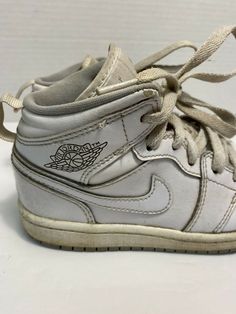 Kids Nike Air Jordan Retro 1 White Wolf Gray 640734-112 TD Sz 12c athletic shoes.  General wear throughout.  Fair condition.  Creasing to toes.�  Some of midsole is loose.  Sold as pictured. Vintage White Basketball Shoes With Boost Midsole, Vintage Basketball Shoes With Boost Midsole And Round Toe, Vintage Lace-up Basketball Shoes, Vintage Synthetic Sneakers For Sports, Vintage Synthetic Sports Sneakers, Vintage Style Synthetic Sports Sneakers, Vintage Lace-up Synthetic Sneakers, Vintage White Custom Sneakers For Sports, Air Jordan Retro 1