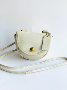 Coach mini belt bag convertible crossbody bag in Bone style no 9826 Minor repair to strap as pictured  Wear throughout typical with age Late 80s early 90s era Unique pushpin closure Very clean interior Classic Crossbody Belt Bag, Mini Belt Bag, Dream Bags, Mini Convertible, 90s Era, Convertible Crossbody Bag, Vintage Coach Bags, Late 80s, Early 90s