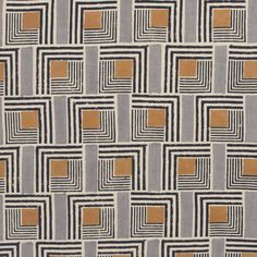 an area rug with squares and rectangles in grey, orange and beige colors