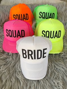 four hats with the words squad squad on them