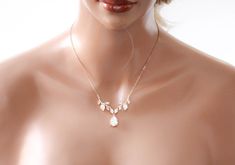 A delicate design with no shortage of sparkle, our simple rose gold cubic zirconia bridal necklace is crafted with Premium Cubic Zirconia stones. Handcrafted to perfection, you will want to wear this necklace long after your wedding day. - Created with Premium Cubic Zirconia stones- Rose gold finish- Available in rose gold, yellow gold, and rhodium finish.- Necklace measures 16 inches and extends to 18 inches- Pendant measures .8 inches x 2.5 inches- Nickel free and hypoallergenic- PLEASE ALLOW Bridal Backdrops, Bridal Backdrop Necklace, Backdrops Necklace, Crystal Bridal Earrings, Simple Rose, Cubic Zirconia Bracelet, Cubic Zirconia Necklace, Cubic Zirconia Earrings, Bridal Bracelet