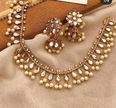 Shine bright in our lovely and simple kundan set with small jhumki back to list. in stock and ready to ship.... Hand crafted and gold plated kundan indian/pakistani jewelry Material:brass,stone,gemstone,pearl  We bring you casual as well as party wear jewelry which comes with an attractive design and style. It goes well modern and traditional outfits. Visit my website for more collections  https://www.etsy.com/shop/Noorzaracollection Note :Color, shades, texture displayed may slightly vary from Pakistani Jewelry Sets Simple, Indian Jewelry Simple, Pakistan Jewelry, Indian Fits, Wedding Jewelry Simple, Hyderabadi Jewelry, Pakistani Jewellery, 2024 Board, Jewelry Hacks