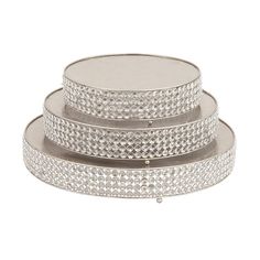 three tiered trays with diamonds on the bottom, one in silver and one in white