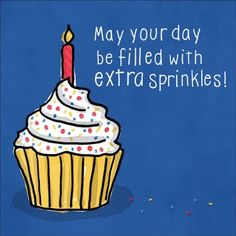 a cupcake with a lit candle on it says may your day be filled with extra sprinkles