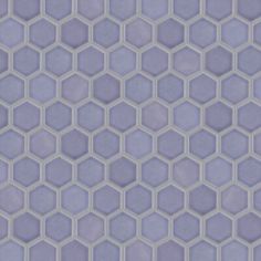 an abstract hexagonal tile pattern in blue and purple tones, with small white dots