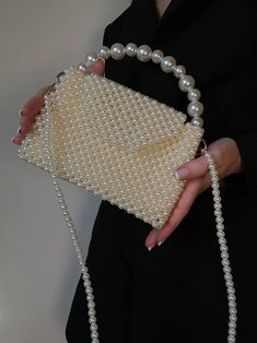 This handmade bag will complete your look. Made with beige acrylic beads. The bag has a beige lining and gold fittings, comes with two handles, one of beads - 1m, another gold chain 1.1 m. Bag dimensions: -Height - 13 cm, with handle 21 cm -Width-19 cm, -Depth 6 cm This bad can hold: - Iphone - car keys ID - driver's license - headphones / AirPods - cardholder - cash lipstick - antiseptic It is ideal for any occasion and for those who love handmade accessories. The bag is very durable and almost Handheld Beaded Beige Evening Bag, Beige Beaded Handheld Evening Bag, Beige Handheld Shoulder Bag With Pearl Handle, Beaded Beige Shoulder Bag As Gift, Beige Beaded Shoulder Bag For Gift, Cream Rectangular Shoulder Bag With Pearl Handle, Beige Pearl Bag For Gifts, Beige Pearl Bags For Gifts, Handmade Cream Shoulder Bag For Party