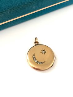 Vintage Victorian 1/10 14k Gold Filled Crescent Moon Star Locket, Gold Filled Celestial Locket, Antique  Keepsake Pendant, Gift for Her Beautiful antique locket with a crescent moon and star. I love the shape of the star and crescent moon, it is a little different than the ones I typically come across, and feels charming and whimsical.  The inside of the locket has both frames and 1 cover still in tact.  The back of the locket is engraved with the name Helen in Old English font.  The locket has some normal small dings and surface scratches, but is in overall very good condition.  It is marked 1/10 14k gold filled on the inside and weighs 8.4 grams. This is a higher gold filled than I normally see, I usually 1/20 12k, so this is a great find and fantastic quality that can last decades more Gold Moon Shaped Jewelry For Formal Occasions, Gold Moon-shaped Wedding Jewelry, Celestial Wedding Jewelry With 17 Jewels, Formal Gold Moon-shaped Jewelry, Luxury Moon-shaped Wedding Jewelry, Formal Gold Moon Shaped Jewelry, Ceremonial Yellow Gold Jewelry With Diamond Accents, Gold Crescent Jewelry With Diamond Accents, Crescent Shaped Single Cut Diamond Jewelry Gift