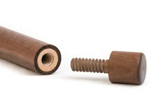 a wooden screw and nut on a white background