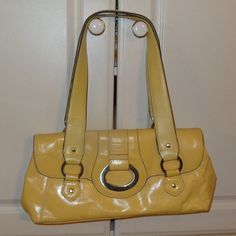 Beautiful Yellow Apartment #9 Handbag Leather! This Handbag Is Vintage And This Color Is Outstanding. This Beautiful Spring Color Will Look Fashionable With All The Colors. Sharp Design With The Big Silver Buckle. It's A One Of A Kind Find! This Beautiful Hand Bag Has A Zippered Pocket That Separates Both Sides. A Zippered Pocket On The Back Side And 2 Pockets On The Other Side That Could Be Used For Cell Phones. But It Is So Soft And So New Looking. Looks Like It's Never Used. No Returns On Vin Everyday Use Satchel Baguette Bag With Silver-tone Hardware, Everyday Satchel Baguette Bag With Silver-tone Hardware, Daily Baguette Satchel Bag With Silver-tone Hardware, Daily Use Baguette Bag With Silver-tone Hardware, Classic Yellow Bag With Silver-tone Hardware, Classic Yellow Bags With Silver-tone Hardware, Everyday Baguette Satchel Bag With Silver-tone Hardware, Double Handle Shoulder Bag With Silver-tone Hardware For Errands, Elegant Yellow Bag With Silver-tone Hardware