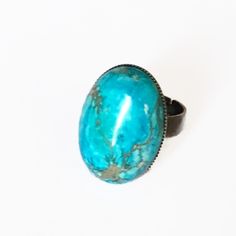 Turquoise blue and bronze ring with oval cabochon (18x25mm) in ocean jasper and sea sediments on adjustable bronze support. Each cabochon is unique. "Sea bathing" ring, "L'aimer l'ange" collection, Fanciful Félicité. Adjustable Turquoise Chrysocolla Ring, Adjustable Turquoise Oval Rings, Adjustable Chrysocolla Turquoise Ring, Adjustable Cabochon Turquoise Ring, Adjustable Cabochon Turquoise Ring In Bohemian Style, Adjustable Turquoise Cabochon Ring, Adjustable Bohemian Cabochon Turquoise Ring, Unique Adjustable Turquoise Ring With Patina, Adjustable Round Cabochon Turquoise Ring