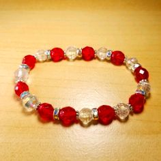 Handmade By Me. Beautiful Red And Clear Crystal Aurora Borealis Beads With Rhinestone Spacers Stretch Bead Bracelet. One Of A Kind! Can Be Worn For A Special Occasion, To The Office, Or To Jazz Up A Casual Outfit. Fits Up To 6 1/2" Wrist. Great For Gifts! The Stretch Cord Will Stretch To Fit, But Then Bounce Back To Its Original Size. Elegant Red Crystal Bracelet With 8mm Beads, Elegant Red Hand-strung Stretch Bracelet, Elegant Red Stretch Bracelet With 8mm Beads, Red Czech Glass Bracelets With Colorful Beads, Red Faceted Beads Bracelet, Traditional Red Faceted Beads Bracelet, Red Stretch Bracelet With Round Beads For Gift, Red Stretch Bracelet With Round Beads For Gifting, Red Crystal Bracelet With 8mm Beads