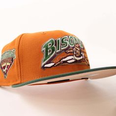 NEW ERA BUFFALO BISONS INTERNATIONAL LEAGUE NEW ERA 59FIFTY FITTED HAT  FIGHT ORANGE crown MOUNTAIN PINE GREEN visor INTERNATIONAL LEAGUE SIDE PATCH BLUSH SKY UNDER BRIM Orange Crown, Orange Mountain, Hat Stores, New Era Hats, Pine Green, New Era Cap, New Era 59fifty, Fitted Caps, Fitted Hat