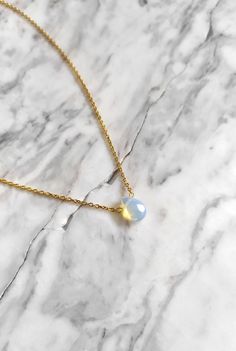 Lune. Such beauty and magic in the most subtle way. Iridescent tiny drop that catch the light give a magical vibe to She who wears this piece. This necklace is composed of 14K gold vermeil delicate chain and tiny opalite drop. It also makes a gorgeous gift for moonstone lovers! Personalize your own magical piece: ❉ 14K Yellow Gold vermeil ❉ 14K Rose Gold vermeil ❉ 925 Sterling Silver You can choose between 2 chain lengths: 16 / 18 inches Not sure which length to buy? We can add a 1 inch extender Dainty Teardrop Pendant Necklace For Layering, Dainty Teardrop Necklace For Layering, Minimalist Teardrop Birthstone Crystal Necklace, Minimalist Teardrop Crystal Necklaces, Handmade Minimalist Opal Necklaces, Minimalist Handmade Opal Necklaces, Dainty Teardrop Opal Necklace, Minimalist Gold Teardrop Crystal Necklace, Minimalist Gold Teardrop Birthstone Necklace