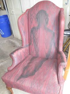 an old chair with some paint on it