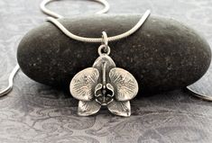 This beautiful sterling silver hummingbird-flower pendant is oxidized to accent it's amazing detail. The hummingbird symbolizes joy, healing, and good luck. In ancient cultures they were believed to be messengers from the spirit world. And who hasn't felt wonderful when this stunning creature has blessed one with it's sudden appearance? This lovely pendant comes with a very high quality, Italian-made, sterling silver snake, rope, or bead chain. Snake Necklace Silver, Orchid Pendant, Orchid Jewelry, Oak Leaf Necklace, Orchid Necklace, Sterling Silver Owl, Goddess Jewelry, Faith Jewelry, Infinity Jewelry