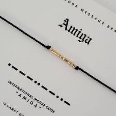 🖤 Dainty and  subtle, "AMIGA" is spelled out in Morse code alphabet using your choice of high quality .925 Sterling silver, 14 karat gold fill, rose gold, and 14 karat solid gold beads. 🖤 Band is made from durable, high quality 100% silk cord in your choice of color. 🖤 End beads and closure bead are coordinating sterling silver or 14 Karat gold / rose / fill. 🖤 Closure is a sliding, adjustable clasp that fits most wrists. 🖤 Bracelets come ready to gift in stylish packaging, 🖤 Morse code ke Alphabet Morse, Code Alphabet, Code Morse, Bracelet Message, Coded Message, Message Bracelet, Morse Code Bracelet, Morse Code, Silk Cord