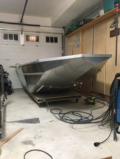 a boat being worked on in a garage