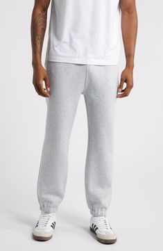 Made from soft cotton-blend fleece, these classic joggers are your go-to pair for lounging, the gym or the street. 27" inseam; 10" leg opening; 12 1/2" front rise; 15" back rise (size Medium) Elastic/drawstring waist Side-seam pockets; back patch pocket 70% cotton, 30% polyester Machine wash, tumble dry Imported Not available for sale and shipment to Germany Relaxed Fit Joggers With Elastic Cuffs For Jogging, Solid Sportswear Sweats With Ribbed Waistband, Casual Everyday Sweats With Straight Hem, Casual Tapered Leg Activewear For Everyday, Casual Cotton Sweats For Sports, Sporty Tapered Leg Sweatpants For Everyday, Athleisure Sweatpants With Tapered Leg For Everyday, Relaxed Fit Activewear With Elastic Cuffs, Everyday Athleisure Sweatpants With Tapered Leg