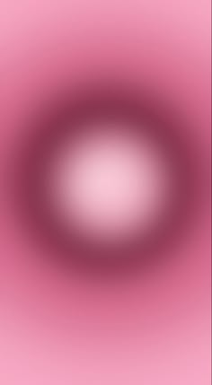 a blurry pink background with an oval shape