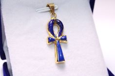 "Egyptian Ankh Cross Key of Life blue 18K Yellow Gold Pendant 1.5 Gr Weight Approximate : 1.5 Gr Height : 1.14\" = 29 mm Width : 0.4\" = 12 mm ✔ IT IS Tested & SIGNED WITH THE EGYPTIAN Gold Government HALLMARK FOR 18K GOLD to Ensure Authenticity. ✔ Lovely gift idea ABSOLUTELY GORGEOUS, LOOKS FABULOUS ON. ✔ 100% Egyptian handmade. ✔ Condition: A brand-new, exactly as on the photos. ★ GIFTS ✔ All items are packaged in a paper jewelry gift box, ready for gifting. ✔ If you are sending a gift directl Symbolic Blue 14k Gold Jewelry, Symbolic Blue Engraved Jewelry, Blue Ankh Jewelry Gift, Blue Symbolic Collectible Jewelry, Collectible Blue Spiritual Jewelry, Blue Spiritual Collectible Jewelry, Egyptian Gold, Key Of Life, Egyptian Ankh