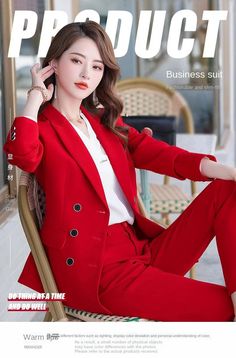 the woman is sitting in a chair with her legs crossed, wearing red pants and a white shirt