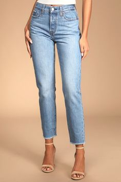 We just can't get enough of the Levi's Wedgie Straight Light Wash Distressed High-Rise Cropped Jeans! Sturdy denim (in Levi's Athens No Way wash) forms these incredibly cute and on-trend jeans with a five-pocket cut, belt loops, and high-waisted fit. Branded top button and hidden button fly top straight pant legs with frayed, cropped hems. Red logo tag and leather patch at back. Fit: This garment fits true to size. Length: Ankle length. Size 26 Waist: Fitted - very fitted at natural waist. Hip: Fitted Medium Wash Cargo Pants, Stretch Cropped Bottoms With Frayed Hem, Medium Wash Fitted Mid-rise Bottoms, Fitted Mid-rise Medium Wash Bottoms, Fitted Mid-rise Medium Wash Pants, Fitted Bottoms With Frayed Hem For Fall, Cropped Medium Wash Bottoms With Frayed Hem, Fitted Mid-rise Bottoms With Frayed Hem, Spring Stretch Jeans With Belt Loops