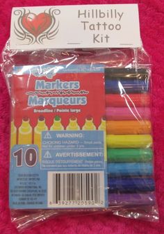 an assortment of crayons and markers on a pink blanket with the tag that says,