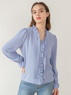 Editor's NotesThis product is a feminine blouse with frill decorations at V-neck and front placket. It features a design that is styled by tying a string attached to the neckline and has a voluminous feel by adding shirring to the shoulder to create a feminine yet cute mood. In addition, buttons are dyed in the same color as the fabric color to give a sense of unity.- Frill decorations at V-neck and front placket- A design that is styled by tying a string attached to the neckline- A voluminous feel by adding shirring to the shoulder - Buttons dyed in the same color as the fabric colorMeasurements(in.) Size: One Size(XS-M) - TotalLength: 24.01in.- Shoulder: 14.37in.- Chest: 18.89in.- Hem: 18.89in.- Sleeve Length: 23.62in. *Model info:(Alina) Height 5' 64, Office Blouse With Ruffles And Tie Neck, Feminine Tie Neck Blouse For Office, Feminine Tie Neck Tops For Office, Tie Neck Ruffled Blouse For Workwear, Ruffled Tie Neck Blouse For Work, Spring Office Wear Blouse With Ruffles, Spring Office Wear Ruffled Blouse, Tie Neck Ruffle Blouse For Daywear, Spring Office Wear Tops With Ruffles