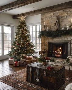 a living room filled with furniture and a christmas tree in front of a fire place