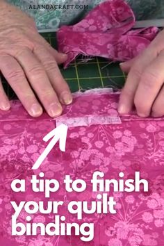 someone is cutting fabric with scissors and sewing tape to make a flowered quilt pattern