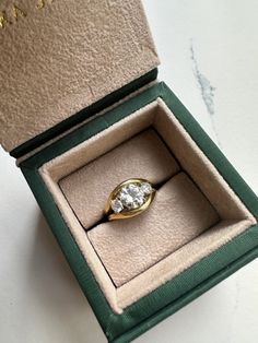 an open box with a ring in it