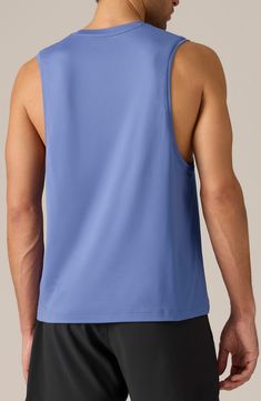 Built to be an ideal workout partner, this sleeveless T-shirt quickly wicks away sweat and the antimicrobial fabric keeps the stink to a minimum. 27" length (size Medium) Crewneck Sleeveless Moisture-wicking fabric engineered for dryness and comfort GoldFusion™ antimicrobial technology with gold nanoparticles is engineered to inhibit the growth of odor-causing germs and remains 99.9% effective for the lifetime of the garment 94% polyester, 6% spandex Machine wash, tumble dry Imported Sporty Solid Color Crew Neck Muscle Tee, Functional Go-dry Crew Neck Muscle Tee, Functional Stretch Muscle Tee With Crew Neck, Athleisure Tops With Dropped Armholes For Gym, Blue Sleeveless Tank Top For Gym, Blue Stretch Sports Vest, Stretch Moisture-wicking Crew Neck Muscle Tee, Moisture-wicking Stretch Muscle Tee With Crew Neck, Functional Moisture-wicking Crew Neck Muscle Tee