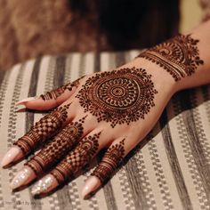 henna tattoo on the hand of a woman