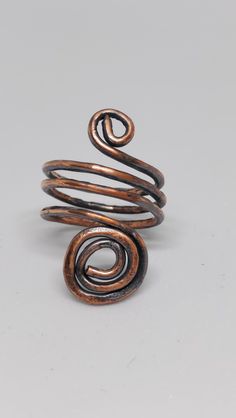 Hand-crafted adjustable ring made of copper that was dipped in the liver of sulfur. Adjustable Bronze Metal Ring, Adjustable Nickel-free Rust-colored Jewelry, Adjustable Rust-colored Nickel-free Jewelry, Adjustable Bronze Open Ring, Adjustable Copper Metal Ring Jewelry, Unique Handmade Copper Rings, Handmade Bronze Midi Rings, Bronze Copper Open Ring Jewelry, Bronze Copper Open Ring