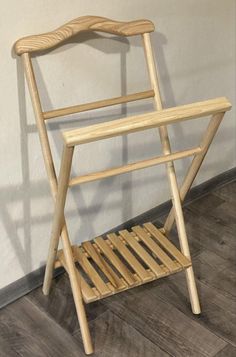 a wooden chair sitting on top of a hard wood floor