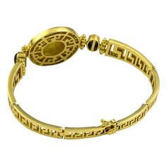 For Sale on 1stDibs - This S.Georgios designer yellow gold 18 karat Bracelet is all handmade and features a coin of the Athena (replica - a copy from the original) the Goddess Luxury Engraved Round Bracelets, Engraved Gold-plated Round Bracelet, Engraved Gold-plated Bracelet, Engraved Round Gold-plated Bracelet, Yellow Gold Intaglio Bracelet For Formal Occasions, Formal Yellow Gold Intaglio Bracelet, Formal Yellow Gold Intaglio Bracelets, Luxury Engraved Gold Bracelet, Luxury Engraved Round Gold Bracelet