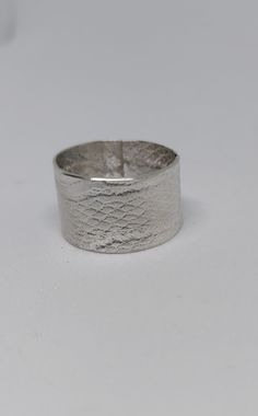 Hand-crafted texture Sterling silver band. Approximately 1/2" inches, Size 7 1/2 Silver Hammered Open Band Rings, Elegant Adjustable Wide Band Ring, Formal Hammered Thick Band Jewelry, Formal Hammered Wide Band Ring, Formal Hammered Jewelry With Thick Band, Elegant Handmade Wide Band Ring, Elegant Handmade Thick Band Wide Ring, Classic Silver Etched Bands, White Gold Jewelry With Hammered Wide Band