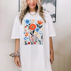 Looking for a cute versatile top to wear this summer? Make sure to grab one of our Cottagecore Floral garment dyed graphic tees! This soft and comfortable graphic tee is the perfect top for any outfit. It can be paired with biker shorts, jeans, or even a simple skirt/dress! This tee is true-to-size, so be sure to order your regular t-shirt size! If you are looking for a more oversized look, make sure to size up! Wildflower Shirt, Comfort Colors Tshirt, Trendy Flowers, Flower Shirt, Flower Child, Graphic Tees Women, Casual Fits, Dye T Shirt, Vintage Look