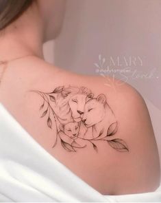 a woman with a lion tattoo on her shoulder