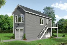 a two story garage with stairs leading up to the second floor and an upstairs balcony