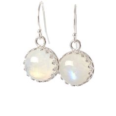 "Stunning Rainbow Moonstone Dangle Earrings made with genuine moonstone (June Birthstone) and set in sterling silver crown bezel setting. These earrings could make a wonderful gift for someone born in June! Just one pair available, and READY TO SHIP. MATERIALS: * natural rainbow moonstone * dangling from French hooks or leverbacks * Sterling Silver * come in our beautiful gift box + card about moonstone SIZE: * moonstones: 10x10 mm * earrings from top to bottom: - 1,8 cm or 3/4\" with french hoo Moonstone Crystal Dangle Earrings, White Cabochon Earrings For Anniversary, Nickel-free Moonstone Moon Earrings, Nickel-free Moonstone Moon-shaped Earrings, Silver Moonstone Birthstone Earrings, Moonstone Drop Earrings With Natural Stones, Silver Moonstone Earrings With Birthstone, White Moonstone Birthstone Earrings, Silver Birthstone Earrings With Moonstone