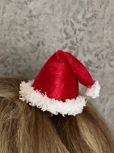 "My handcrafted mini Santa Hat is easy to either clip into hair or add to your plastic or metal headband for quick, holiday charm. Available in either traditional red or festive green, the hat is made from panne \"velvet\" and fur-like trim.  It's lightweight and compact.  Enjoy wearing your seasonal hat without worry about traditional holiday \"hat hair\" once it's removed!   Choose the attachment device that works best for you:  an alligator clip or a slide-thru casing (this allows you to slid Red Christmas Holiday Headband, Adjustable Red Mini Hats As Gifts, Adjustable Red Hat For Festive Occasions, Adjustable Hair Accessories For Christmas Gifts, Adjustable Christmas Hat As Gift, Adjustable Red Mini Hat For Christmas, Red Adjustable Mini Hat For Christmas, Red Mini Hat For Winter Gift, Red Adjustable Festive Hat