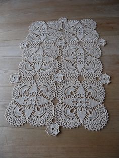 a white doily is laying on the floor