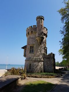 an old castle like building on the beach