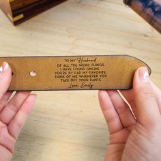 two hands holding a leather bookmark with the words to my husband or all the weird things you have found online