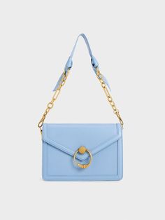 Our Joelle bag offers the perfect blend of femininity and practicality. The pastel light blue makes it a great option for everyday, matching a variety of outfits with ease. Plus points for the brushed gold-toned chain ring that adds visual interest to an otherwise simple design. Complete with two detachable straps for extra styling versatilty, you will find yourself reaching for this structured beauty all through the year. White Sling Bag, Pastel Light Blue, Leather Bag Design, Eyewear Chain, Summer Palette, Glam Photoshoot, Beige Bag, Ladies Purse, Pretty Bags