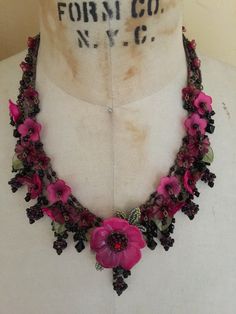 With deep reds and blacks this is a stunning necklace to give that black dress in your closet some pizazz. Little flowers dangle from a handmade chain. Made with nickel free chain and metal components, resin flowers and glass beads. Measures 19 inches with and extender clasp to change the length of the necklace depending on your size and the neckline of the dress. Extender measures 4 inches. There is no glue used in this creation. All beading is hand sewn or wired for a secure and long lasting q Fabric Flower Necklace, Crochet Necklaces, Turtle Soup, Dress Extender, Dolly Kei, Beach Jewelry Boho, Dance Necklace, Handmade Chain, Chic Necklace