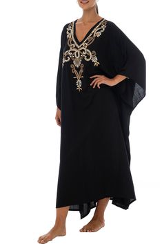 Add a tribal twist to your beach time in this black and gold summer maxi swimwear cover up. Zigzag embroidery adds a spicy accent to this long beach caftan, with a casual vacation vibe and a loose flowy fit that works beautifully on plus sizes. It offers great sun coverage, and is so easy to wear for cruises, lounging, vacation or relaxing days at the beach. Back From Bali is dedicated to creating beautiful, quality clothing with a heart. All of our items are crafted, sewn and painted by hand in Bali, by local artists and women who own small home businesses. For over 20 years, we have nurtured fair, honest and caring relationships with our artisans and their families – so you can feel as good about wearing our products as they feel about making them. Make waves in this black summer maxi sw Embroidered Beachwear Maxi Dress As Beach Cover-up, Embroidered Beachwear Maxi Dress, Long Embroidered Cover-up For Vacation, Embroidered Beachwear Maxi Dress For Beach, Embroidered Maxi Beach Dress, Long Embroidered Beach Kaftan, Embroidered Long Kaftan For Beach, Long Embroidered Kaftan For Beach, Flowy Embroidered Maxi Dress For Vacation