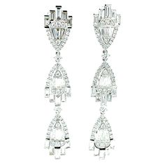 These Art Deco-inspired dangle earrings are simply spectacular! They are just in time for the holidays and perfect for every special occasion imaginable! Over 5 and a half carats of top quality diamonds are masterfully arranged in an elegant, decadent, and ultra-sophisticated triple chevron design of striking 18k white gold. Diamonds, particularly tapered and straight baguette cuts, must be exceptionally well-cut and have superior color and clarity to be as brilliant as these. The Art Deco influ Diamond Baguette, Chevron Design, Baguette Cut Diamond, White Gold Earrings, Bride Jewellery, Art Deco Inspired, Baguette Diamond, Matching Bracelets, Quality Diamonds